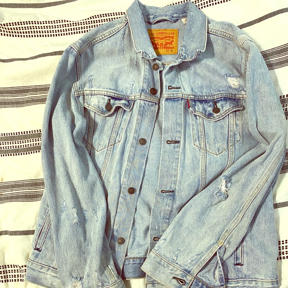 Levi trucker Jean jacket with rips good condition